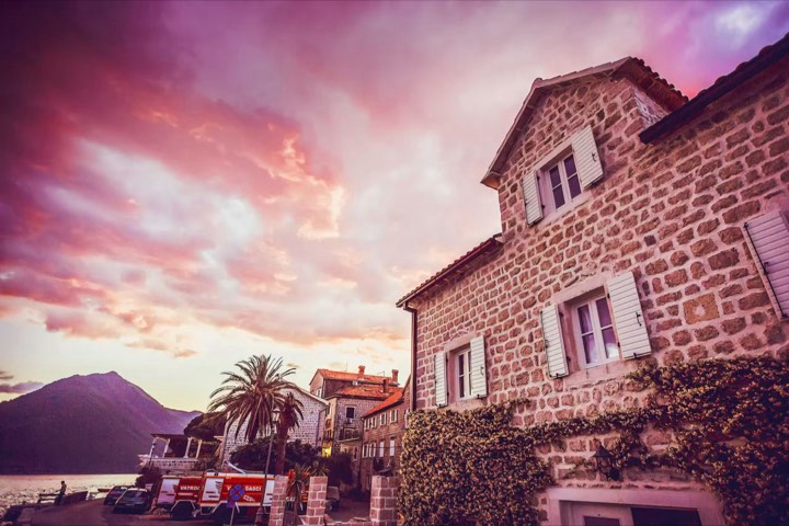 Our house under a pink sunset sky