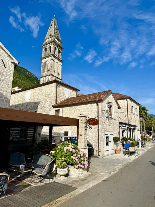 Stone buildings and the bell tower in Perast town